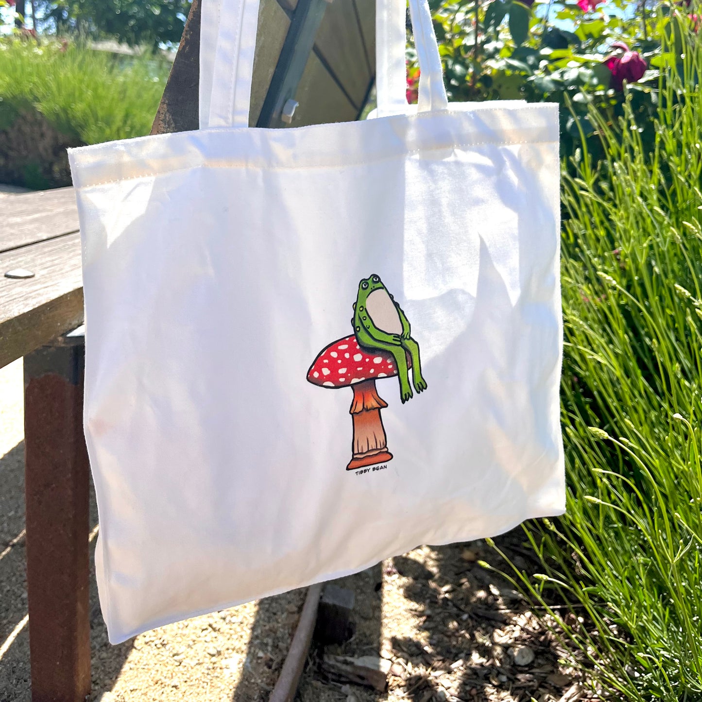 Sitting Toad on Mushroom Tote Bag