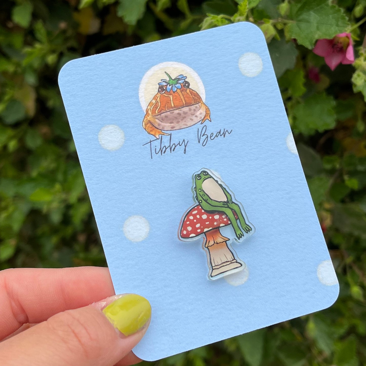 Grumpy Green Sitting Toad on Red Mushroom Acrylic Pin