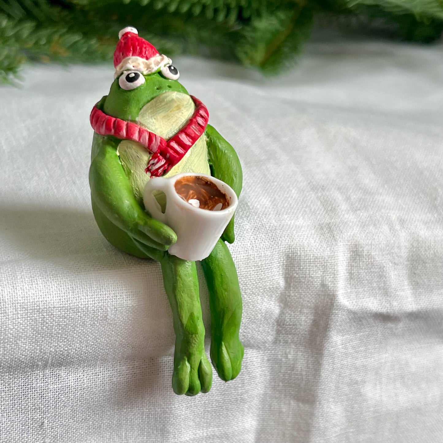 Handmade sitting winter toad figurine