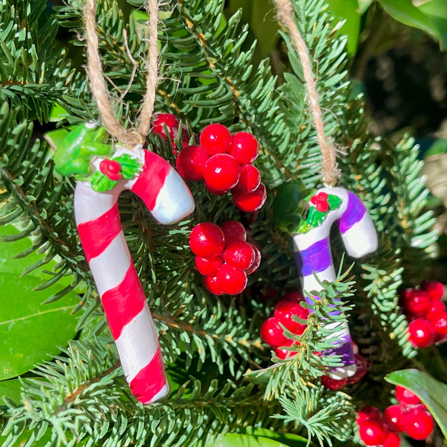 Handmade frogs on candy cane figurine ornaments
