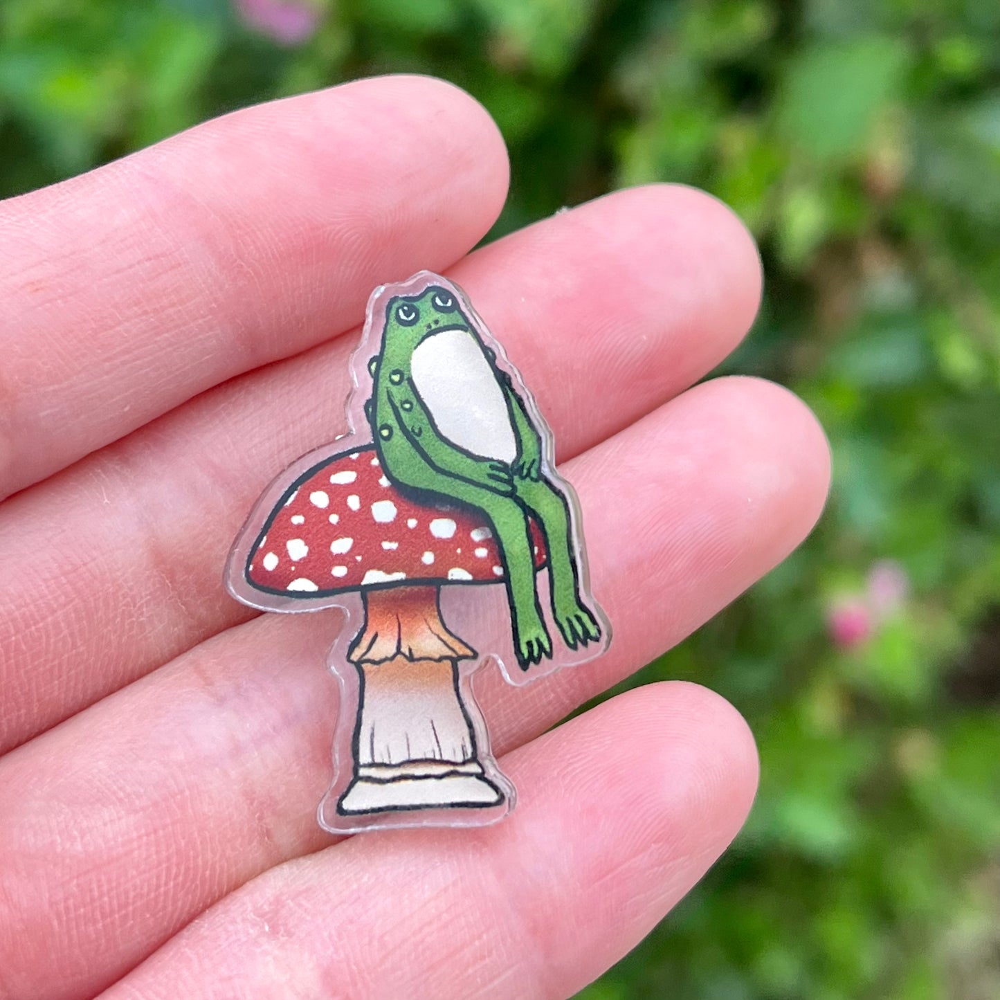 Grumpy Green Sitting Toad on Red Mushroom Acrylic Pin