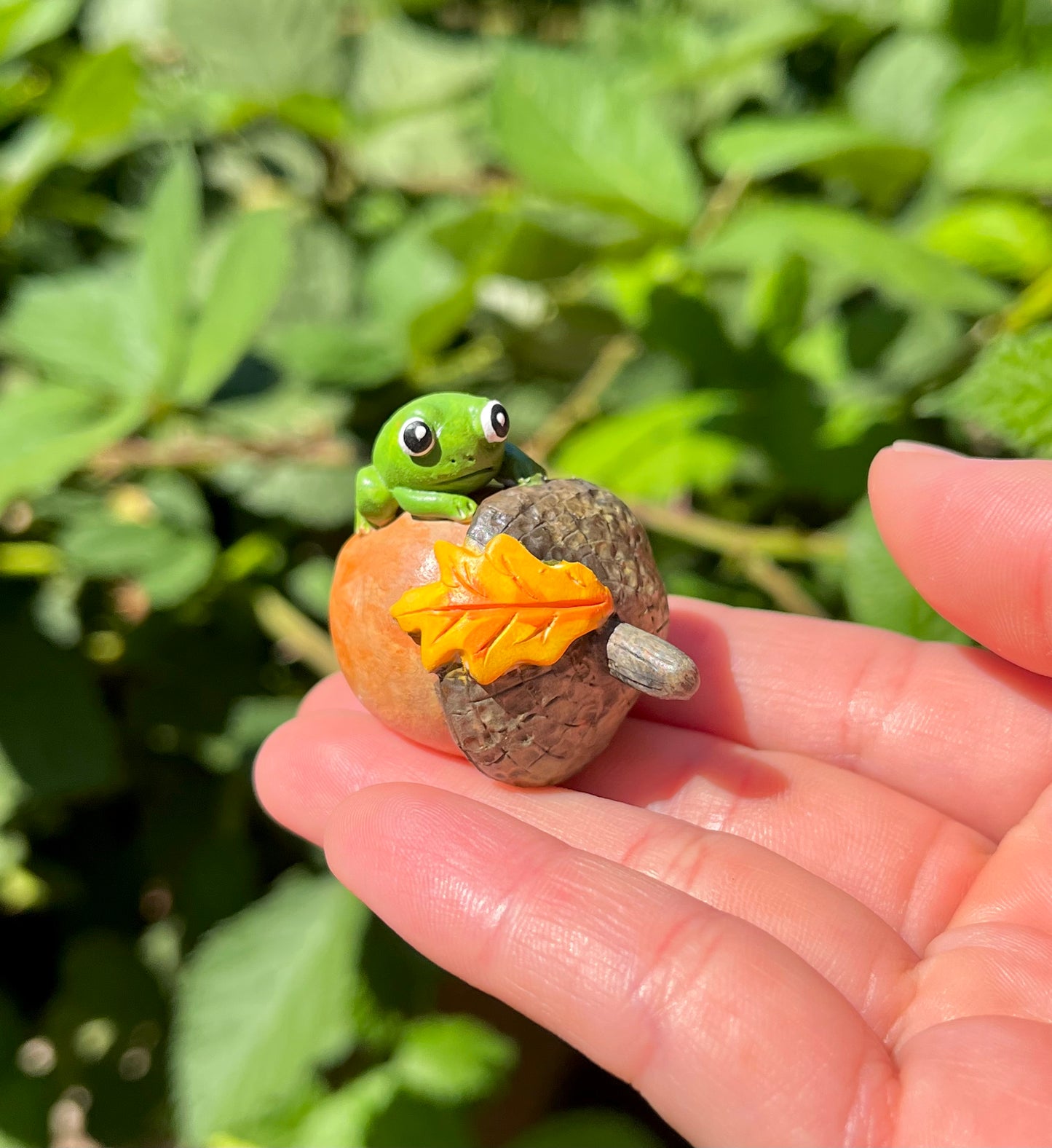 Handmade polymer clay little frogs on fruits figurines