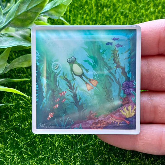 Frog swimming in kelp forest acrylic magnet