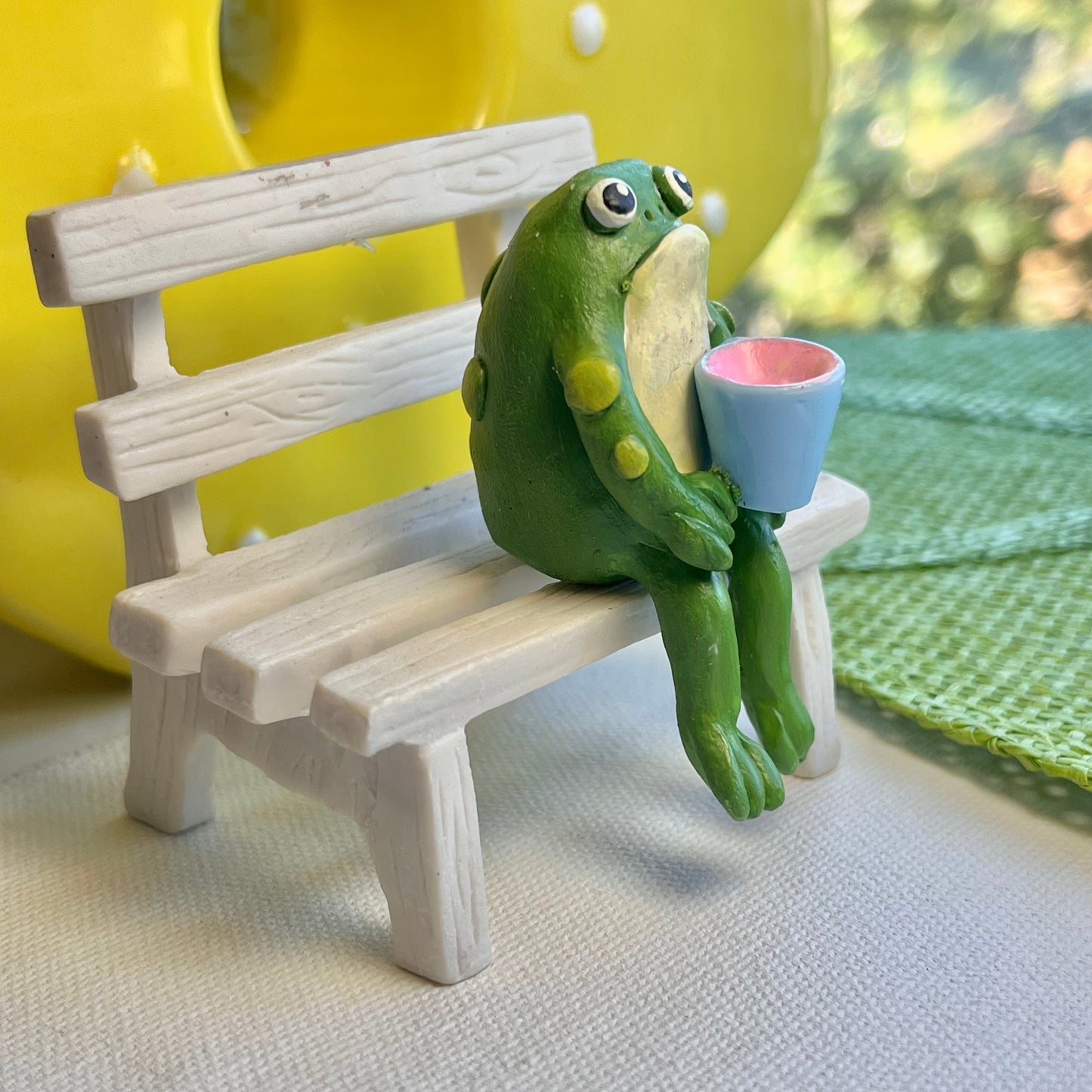 Handmade sitting toad with mug figurine