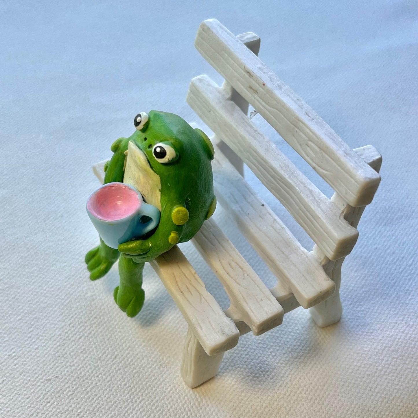 Handmade sitting toad with mug figurine