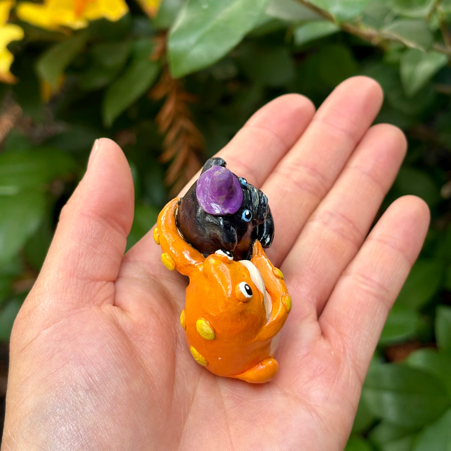 Handmade hugging pug and frog figurine