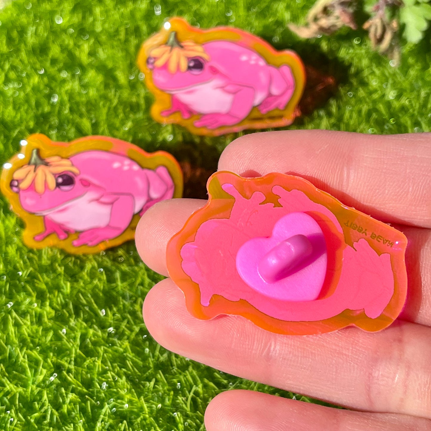 Neon pink flower hat frog acrylic pin