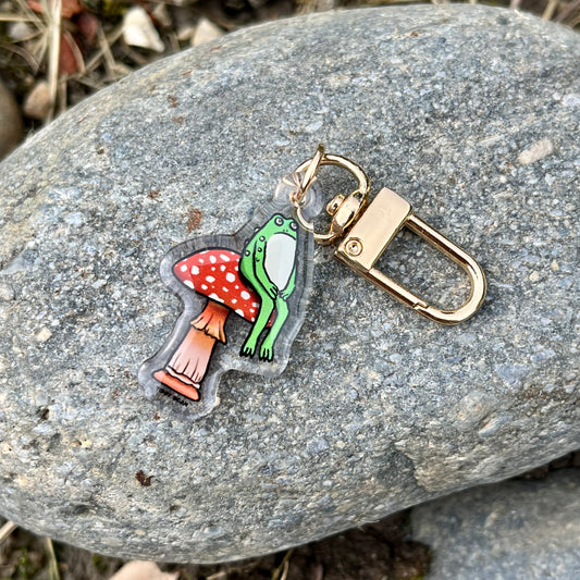 Acrylic sitting toad on mushroom keychain