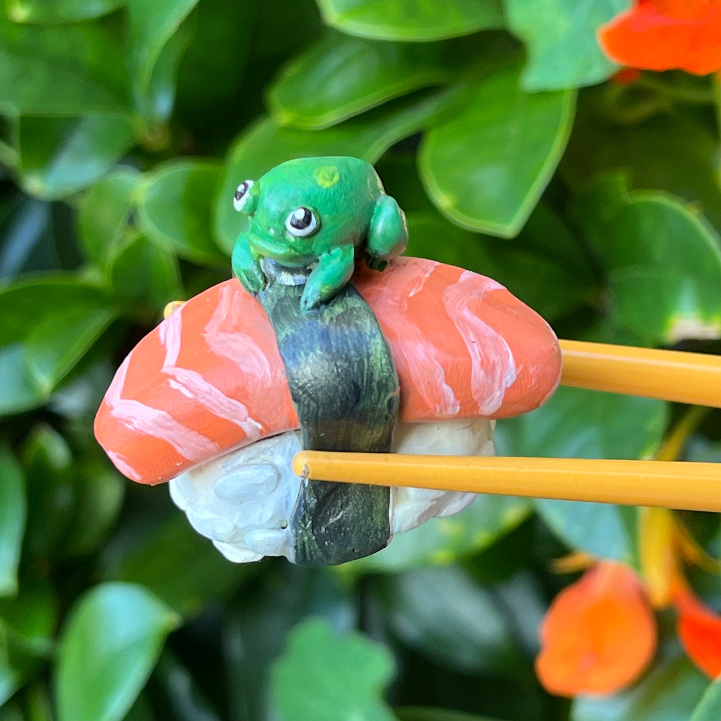 Handmade frogs on food (frushi) figurines