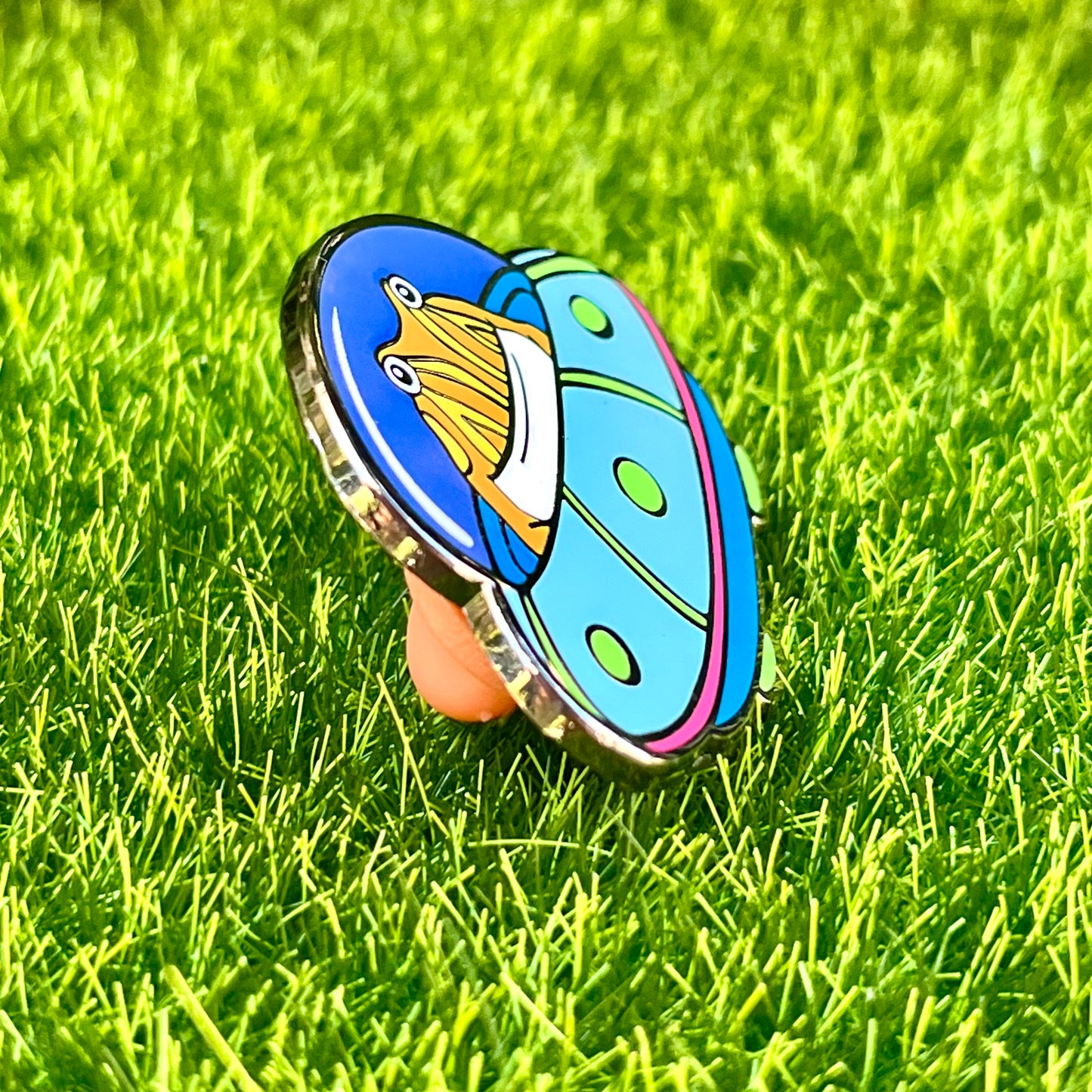 Tibby the frog in a UFO enamel pin