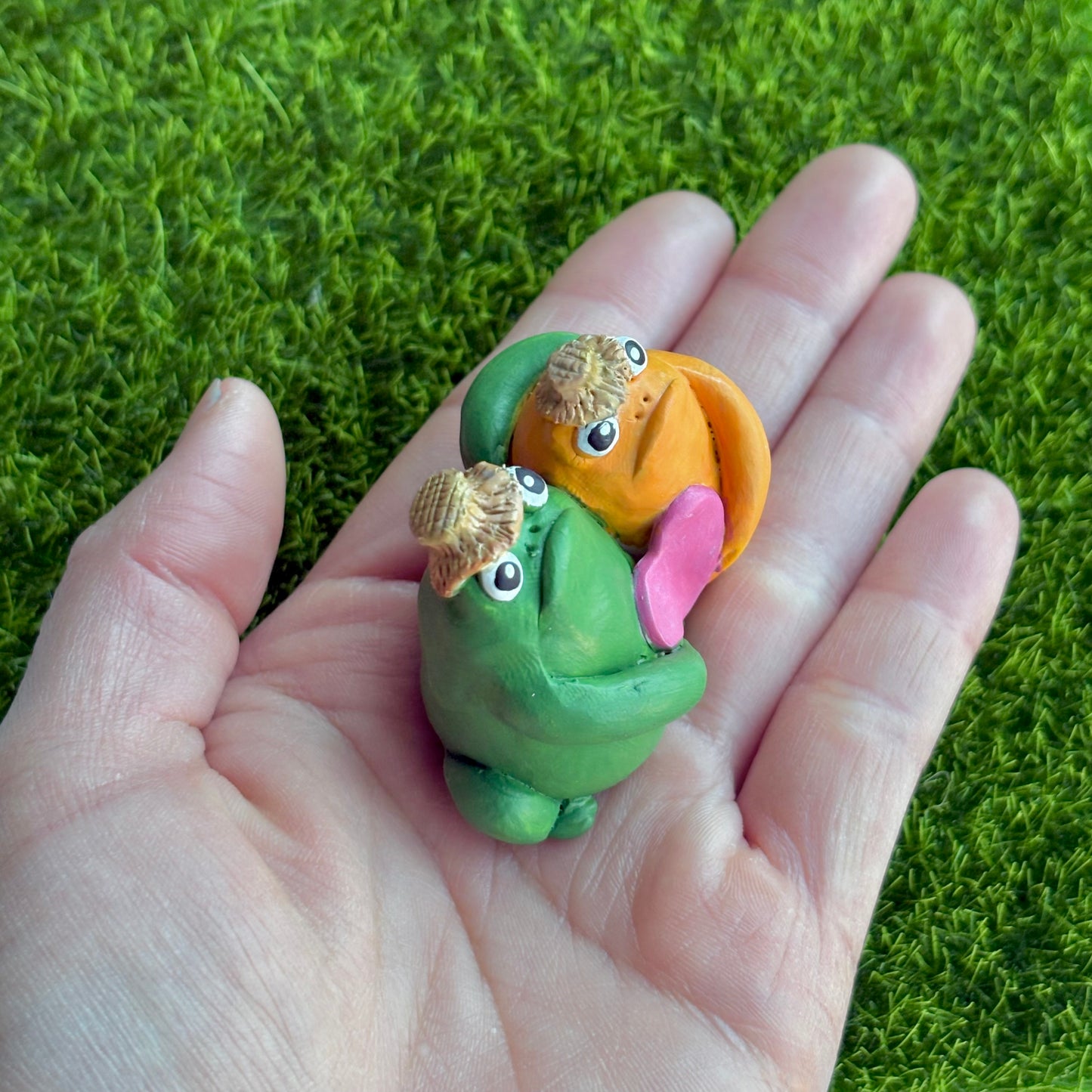 Handmade hugging frog friend figurine