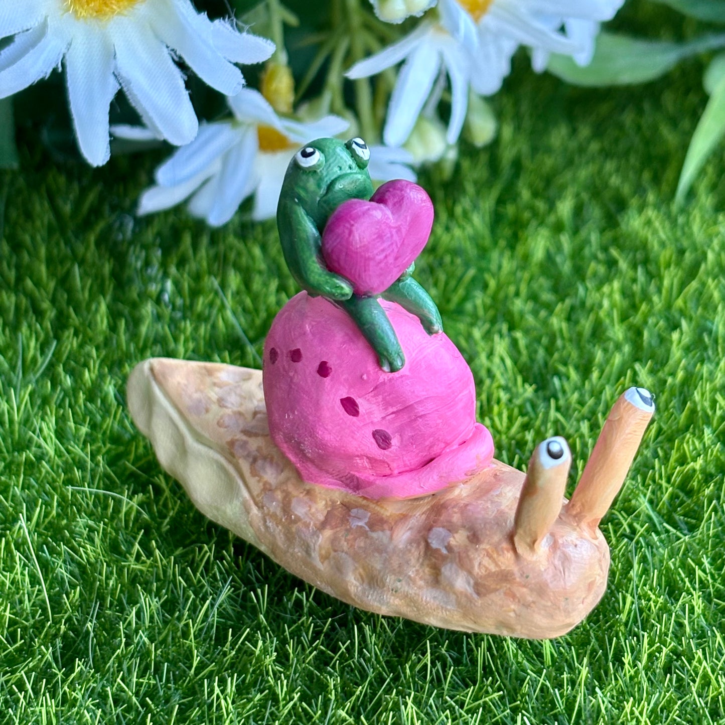 Handmade valentine's frog riding snail figurine