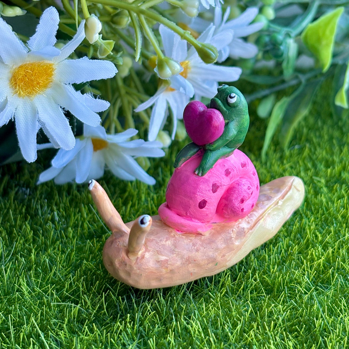 Handmade valentine's frog riding snail figurine